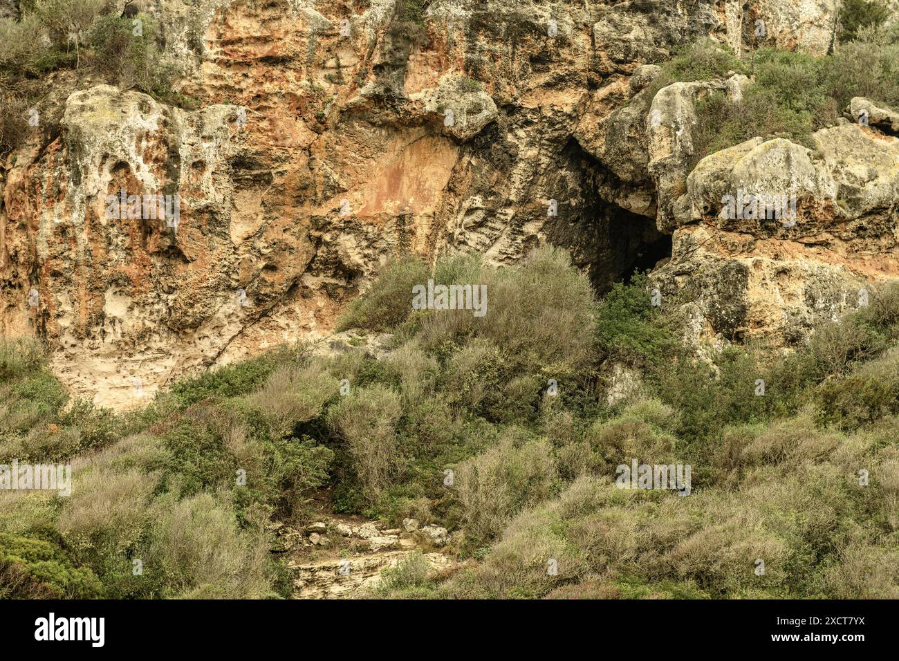 Close-up of the ancient necropolis caves at Cala Coves, Menorca ...