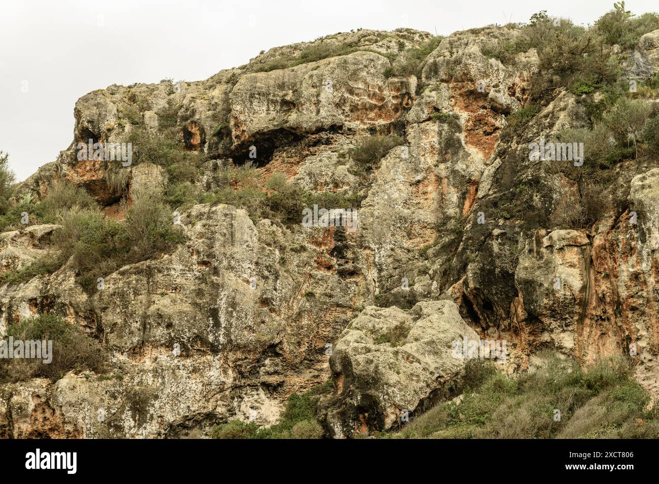 Close-up of the ancient necropolis caves at Cala Coves, Menorca ...