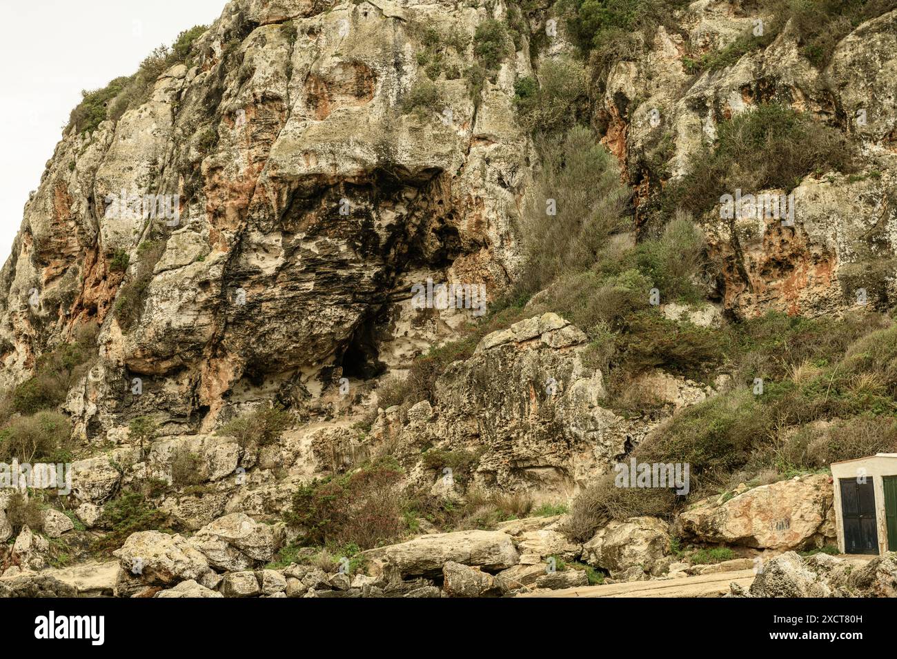 Close-up of the ancient necropolis caves at Cala Coves, Menorca ...