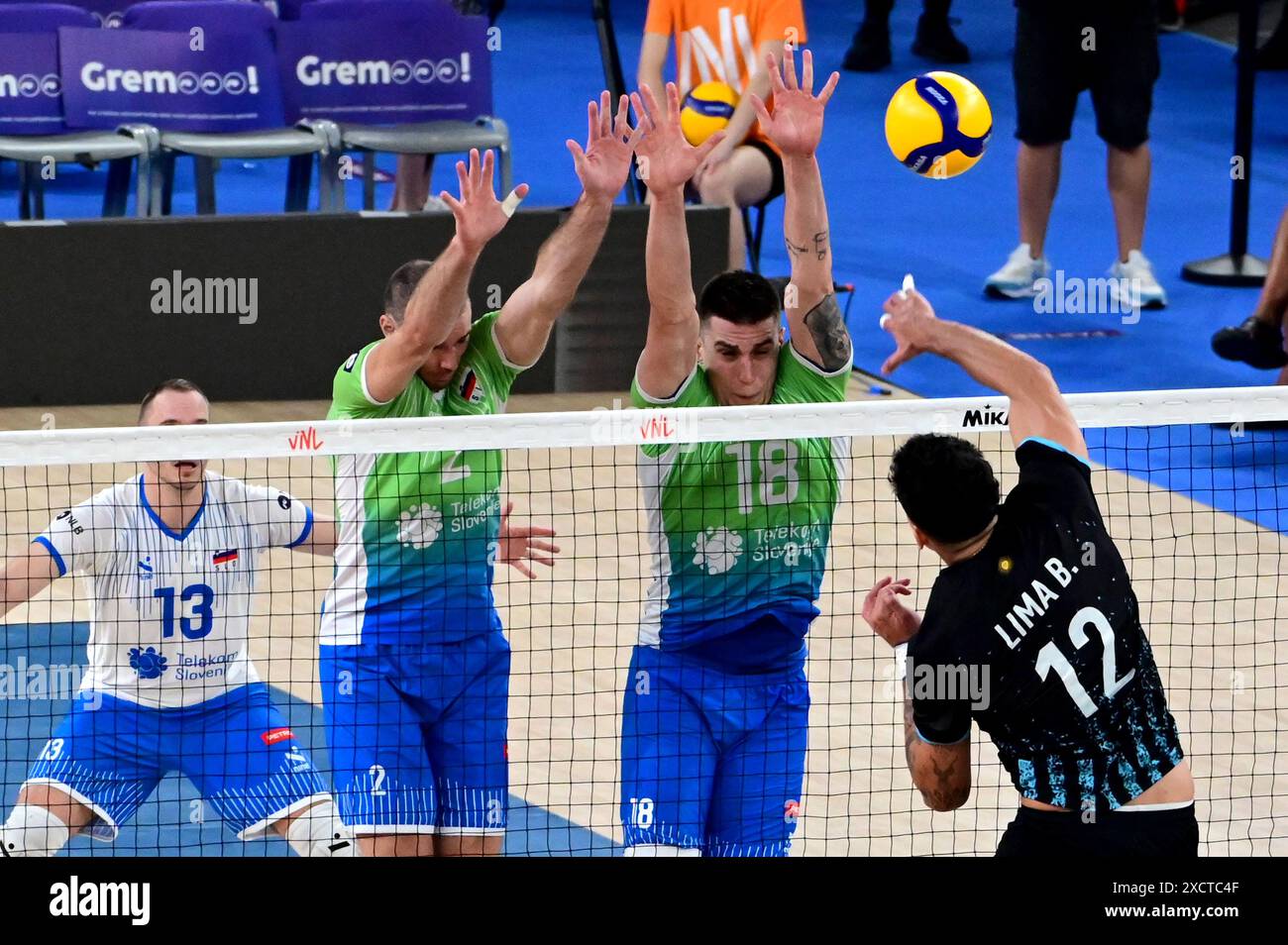 Ljubljana, Slovenia. 18th June, 2024. Ljubljana, Slovenia, June 18st 2024: Bruno Lima of Argentina (R) in action against Klemen Cebulj of Slovenia (C) during the FIVB Men's Volleyball Nations League match between Slovenia and Argentina at Arena Stozice, Ljubljana, Slovenia. (Igor Kupljenik/SPP) Credit: SPP Sport Press Photo. /Alamy Live News Stock Photo