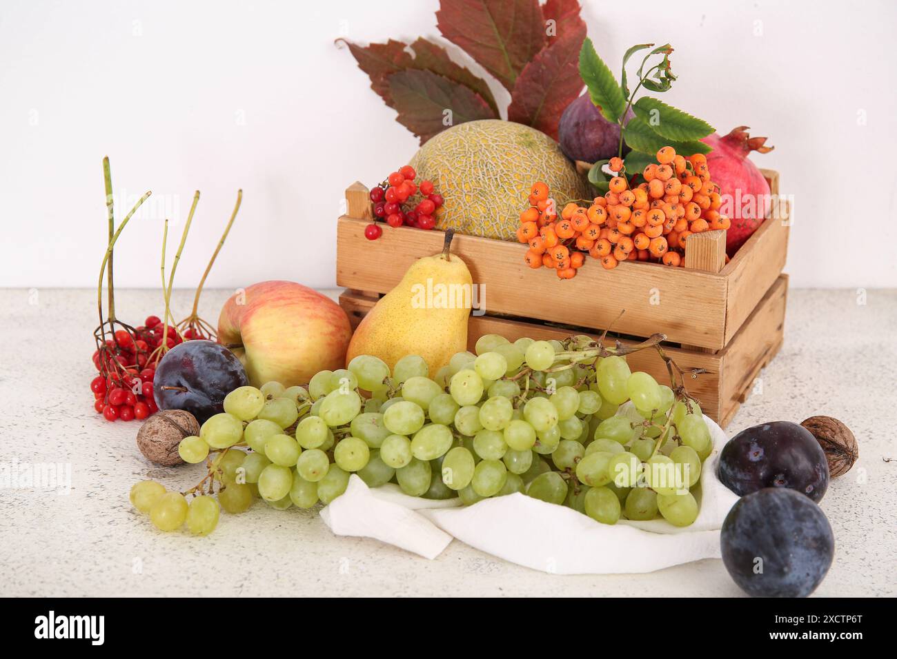 Wooden box with different fresh fruits on white background Stock Photo ...