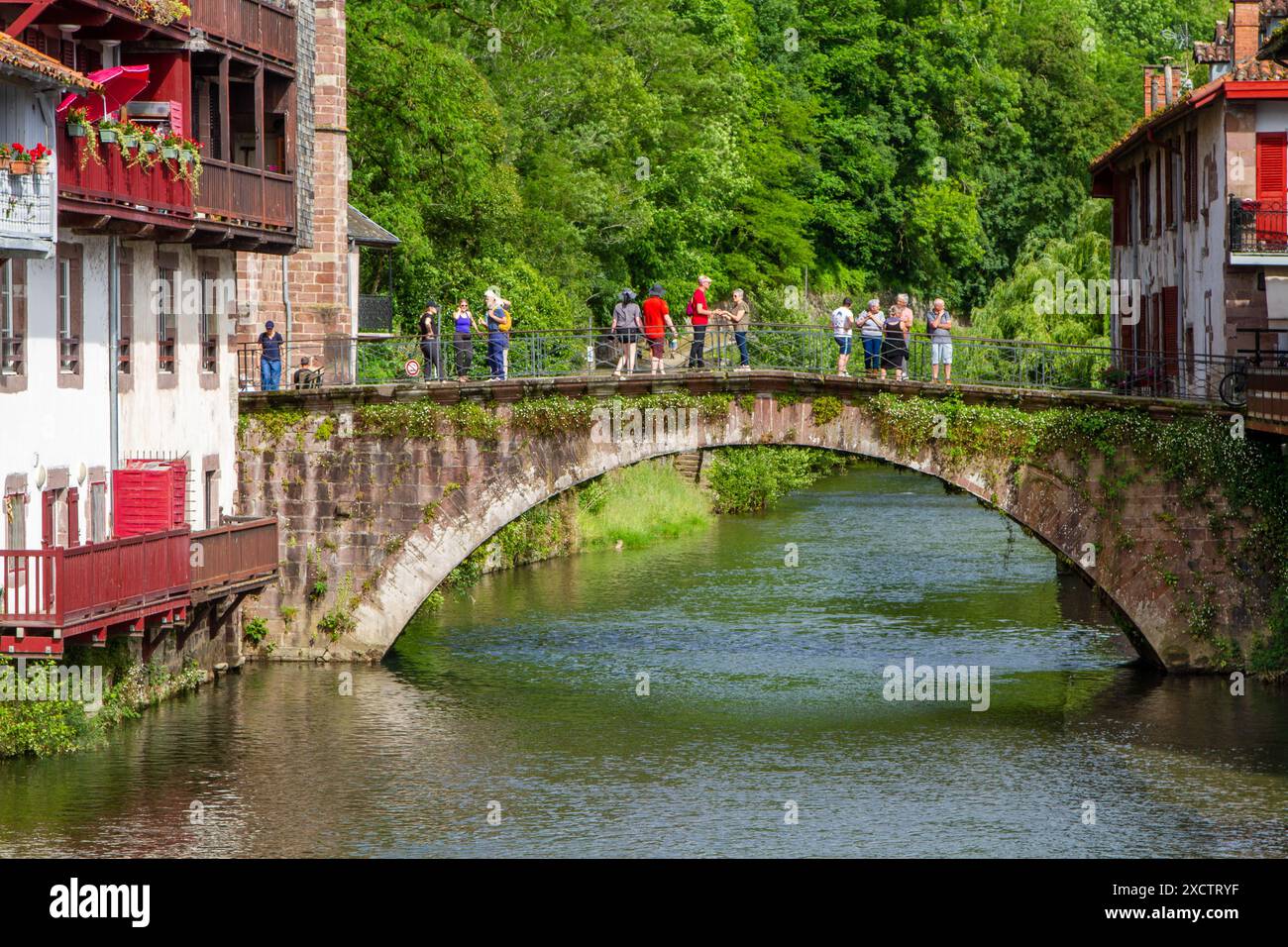The river Nive flowing through the town of Saint-Jean-Pied-de-Port the ...