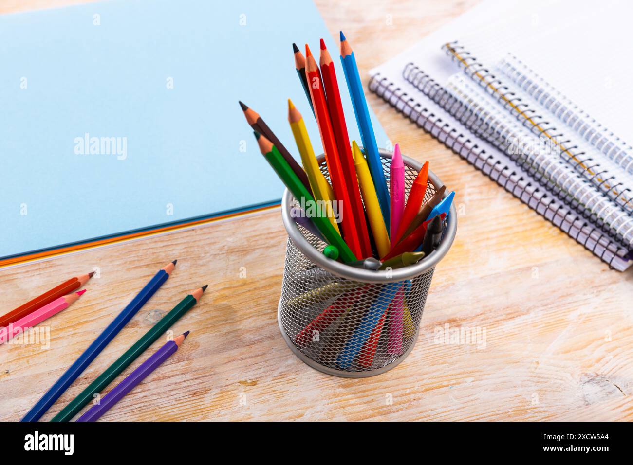 Colored pencils kept in pencil holder Stock Photo