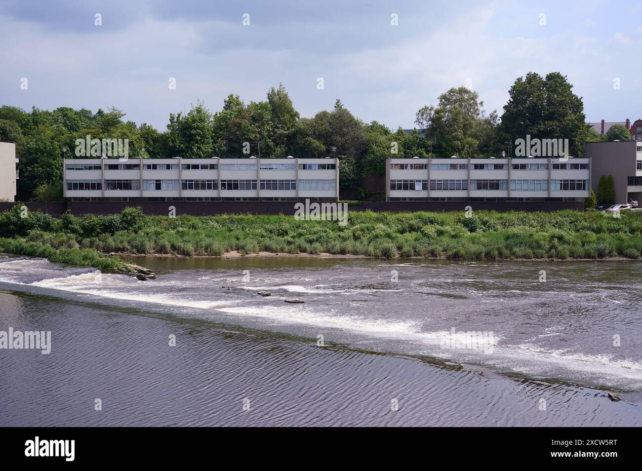 31 may 2024 chester uk Flats / apartments in front of weir on river