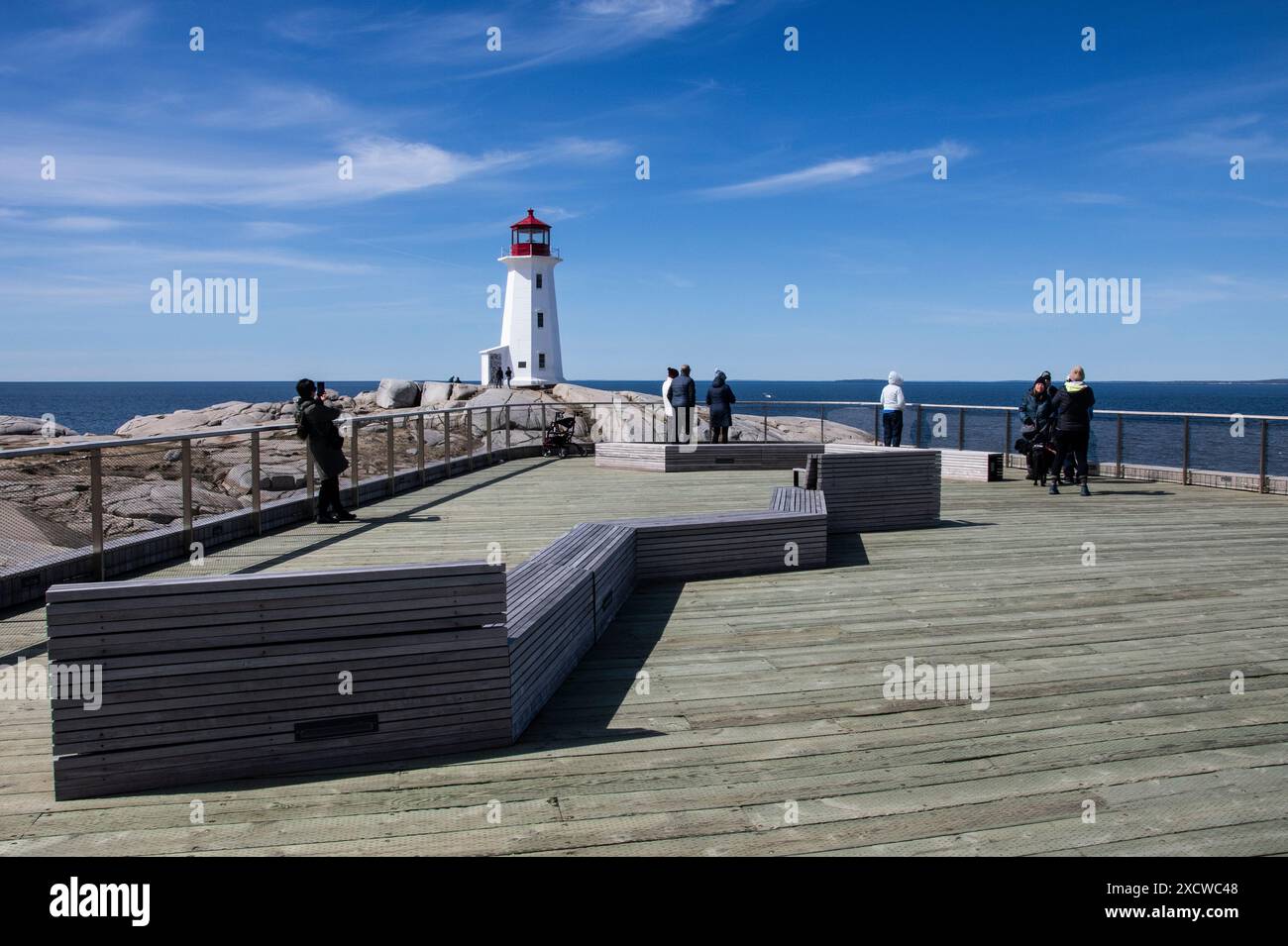 Peggy's Point Lighthouse and wooden viewing platform at Peggy's Cove