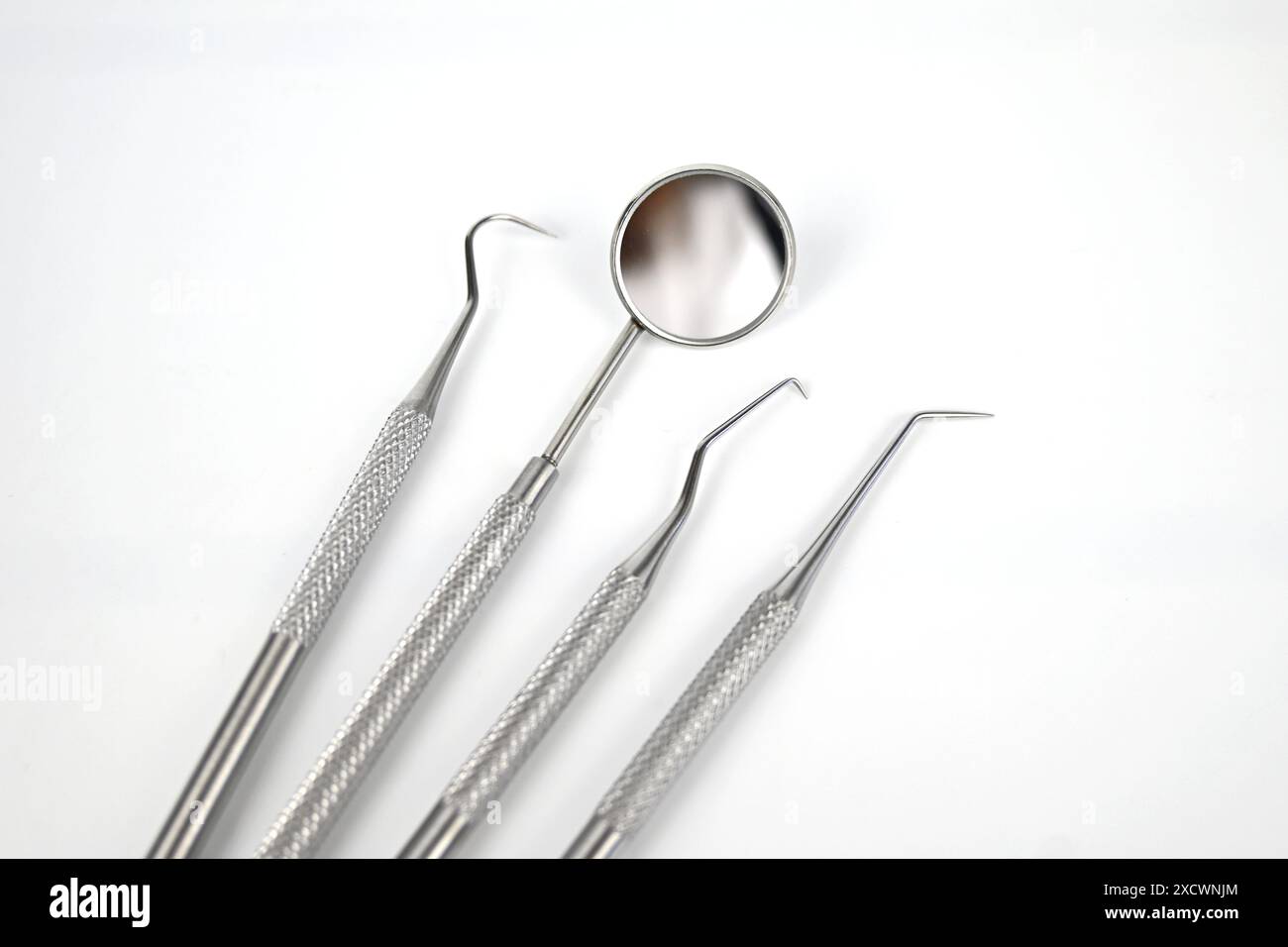 Dental tools on white background – Wales, UK Stock Photo