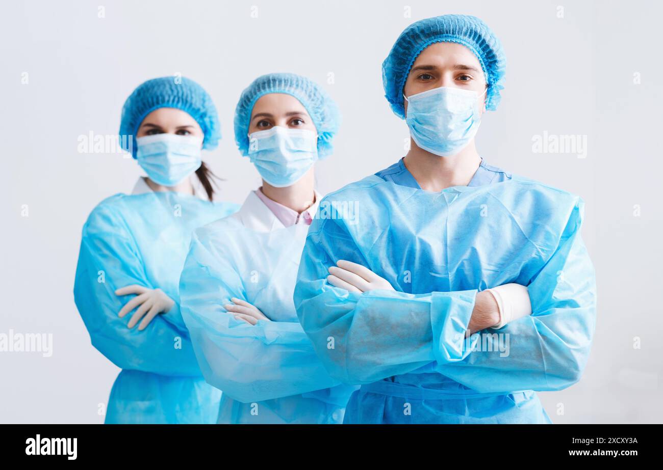 Surgeons Team Ready for Surgery. Practitioners Wearing Protective Uniforms Stock Photo