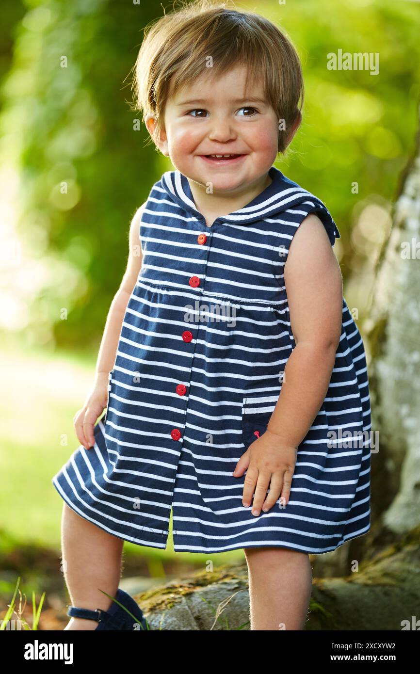 Little girl playing in the garden. Basque Country. Spain Stock Photo ...