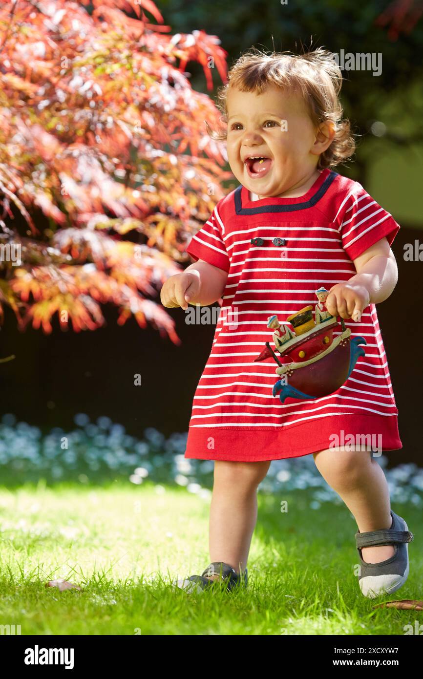 Little girl playing in the garden. Basque Country. Spain Stock Photo ...