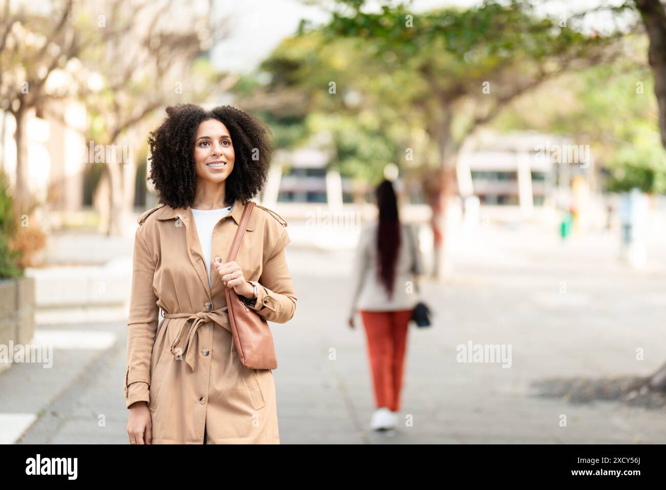Woman black coat in hi-res stock photography and images - Alamy