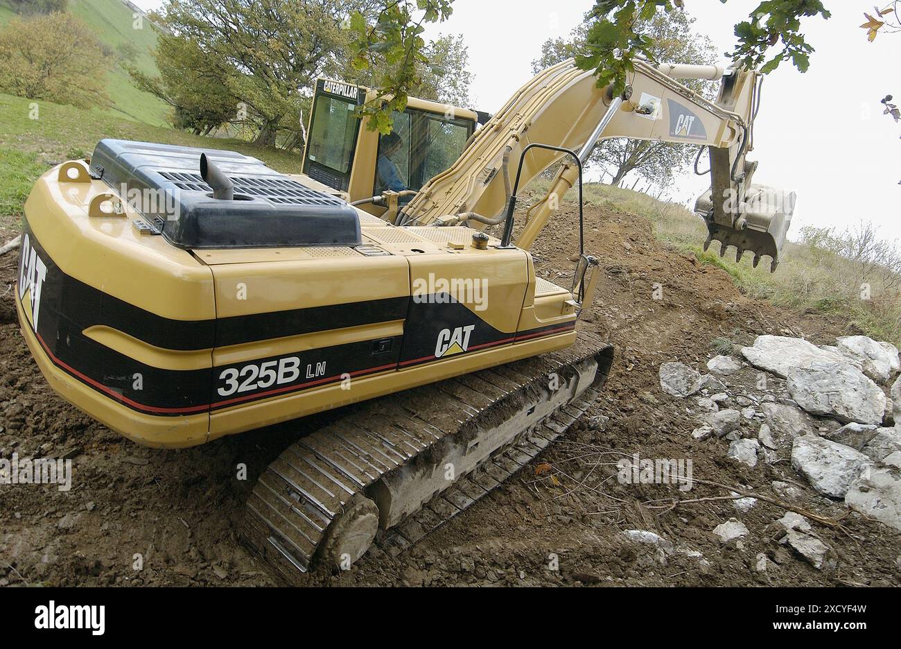 Loading rocks at quarry for construction of breakwater Stock Photo - Alamy