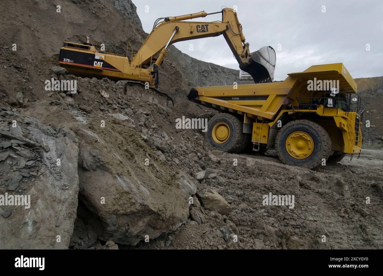 Loading rocks at quarry, Hydraulic Excavator, machinery for public ...