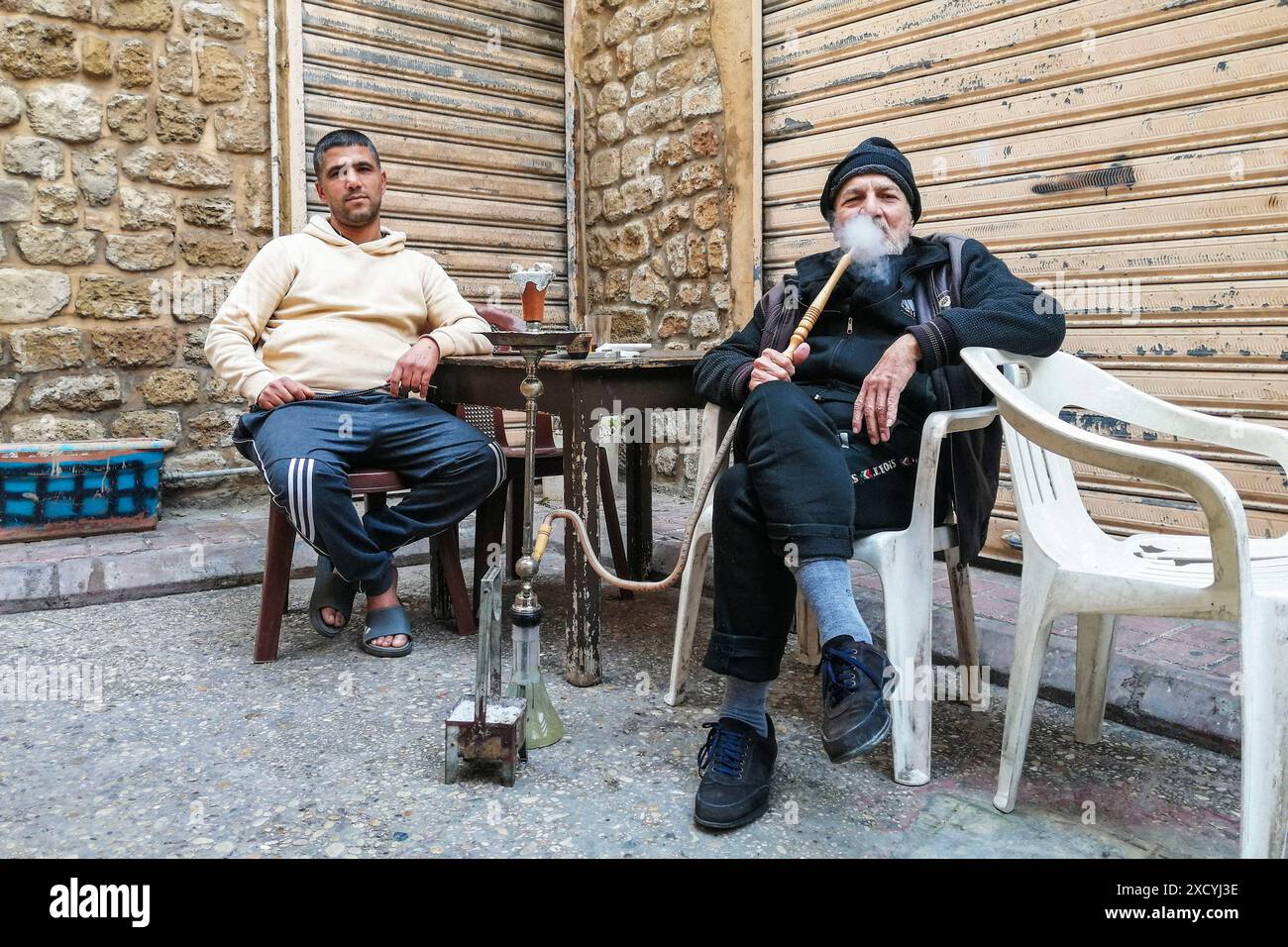 Lebanon, Sour, men smoking shisha Stock Photo