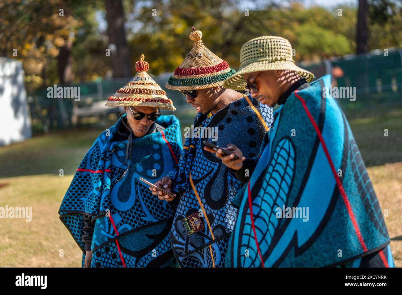 Three Men Wearing Traditional Mokorotlo Hats And Traditional Sotho 