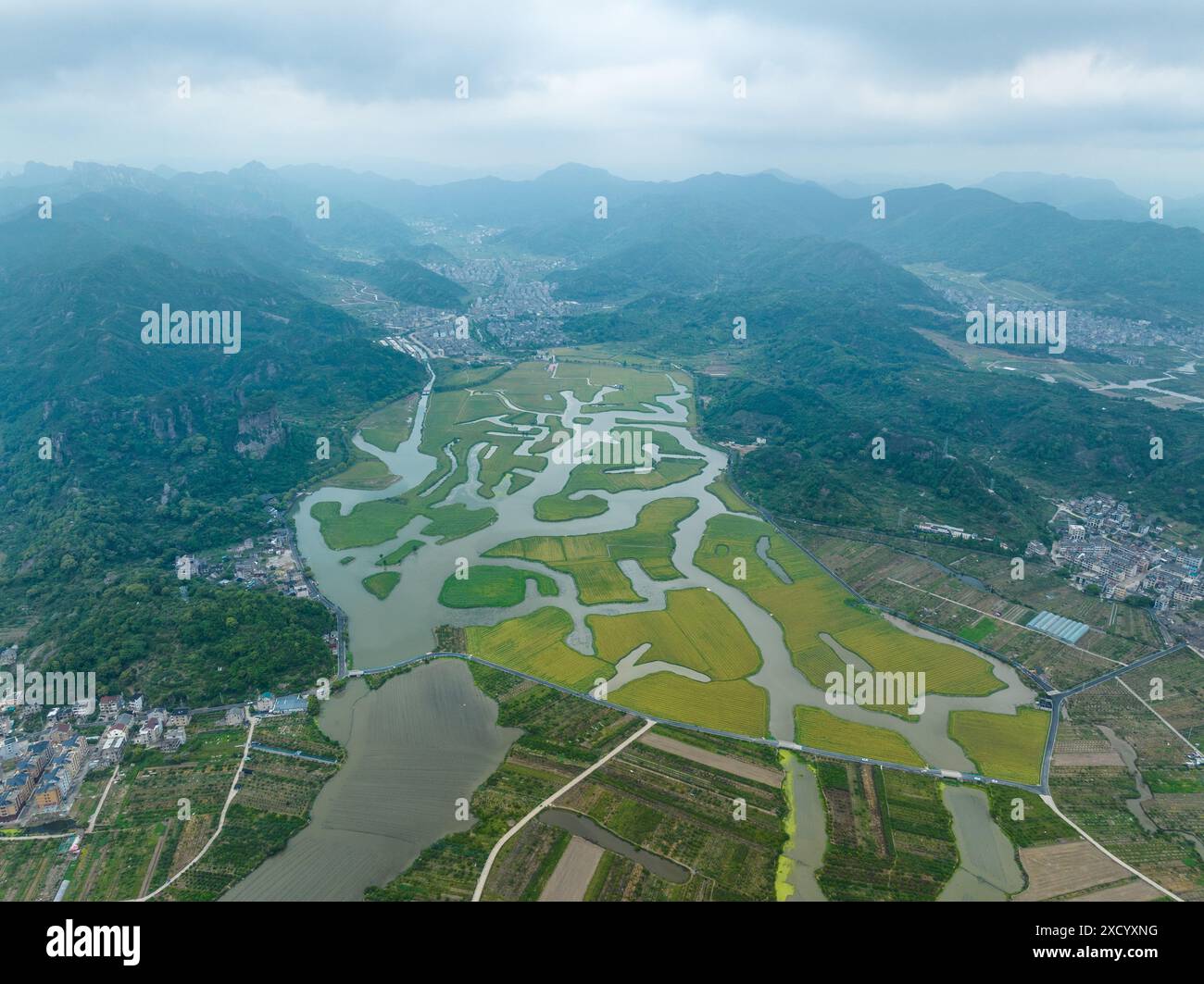 TAIZHOU, CHINA - MAY 3, 2024 - The Taojiang River divides the fields ...