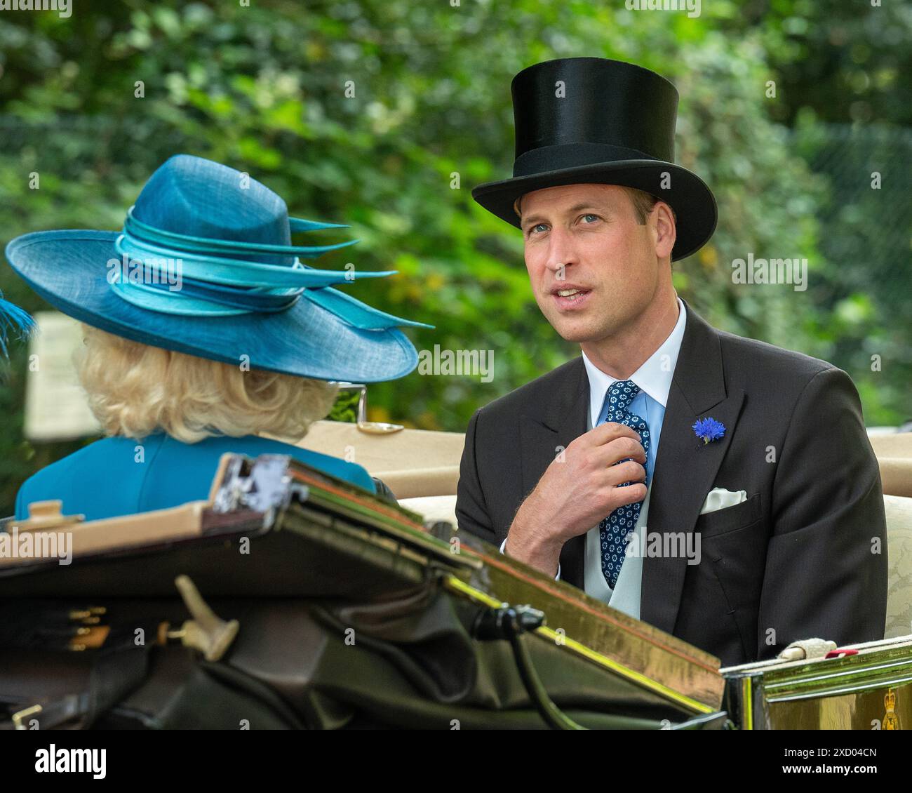 Ascot, UK 19th Jun 2024. Queen Camilla and Prince William, Prince of Wales lead the traditional carriage procession from Windsor, through the leafy Berkshire roads, to the racecourse for the second day of Royal Ascot. Credit: MartinJPalmer/Alamy Live News Stock Photo