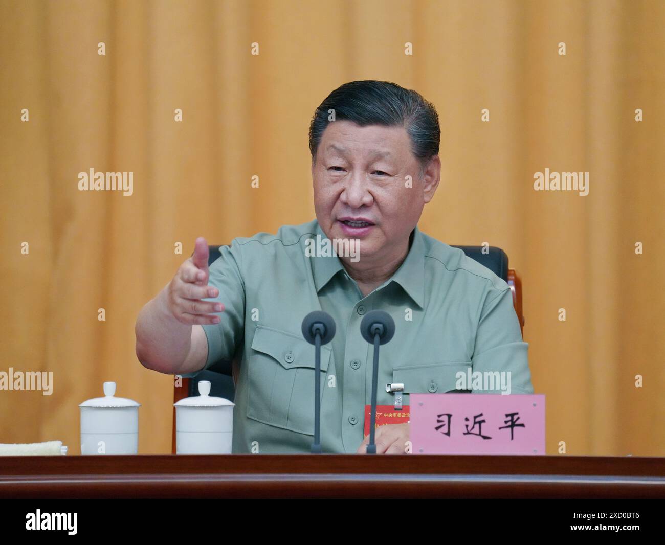 Yan'an, China's Shaanxi Province. 17th June, 2024. Chinese President Xi Jinping, also general secretary of the Communist Party of China Central Committee and chairman of the Central Military Commission (CMC), delivers an important speech at the CMC Political Work Conference in Yan'an, northwest China's Shaanxi Province, June 17, 2024. The CMC Political Work Conference was held from Monday to Wednesday in Yan'an, an old revolutionary base in northwest China's Shaanxi Province. Xi attended the conference and delivered an important speech. Credit: Li Gang/Xinhua/Alamy Live News Stock Photo