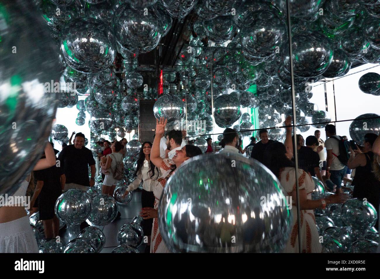 New York City, United States. 18th June, 2024. ''Affinity'' is taking place at Summit One Vanderbilt observation deck in New York, U.S., on Thursday, June 18, 2024. The Summit One Vanderbilt is being a veritable wonderland of sensory experiences. Kenzo Digital, the artist who is designing each room, is using mirrors to reflect and refract the city that is surrounding the structure. The attraction is taking visitors to the 93rd floor, high above iconic skyscrapers like the Empire State Building and the Chrysler Building. (Photo by Aashish Kiphayet/NurPhoto) Credit: NurPhoto SRL/Alamy Live News Stock Photo