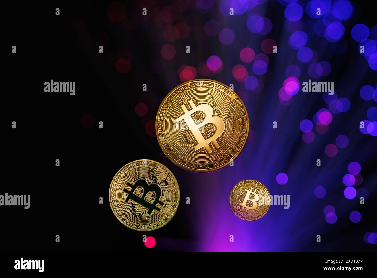 Glowing Bitcoin cryptocurrency against the background of fiber optic cables. Bitcoin digital cryptocurrency consisting of dots and lines, cryptocurren Stock Photo