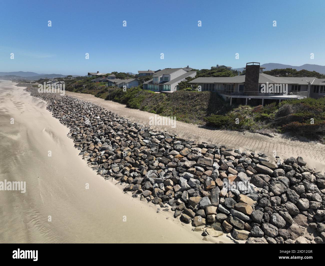 Beach erosion, mitigation,restoration and riprap construction at Salishan Oregon on the Pacific Ocean. Stock Photo