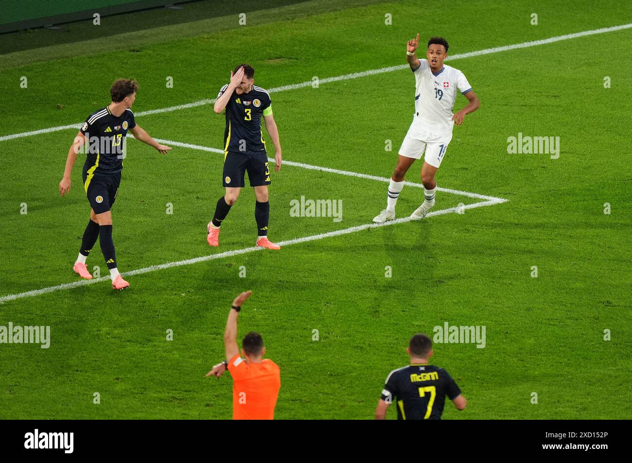 Switzerland's Dan Ndoye (right) reacts towards the referee after his ...