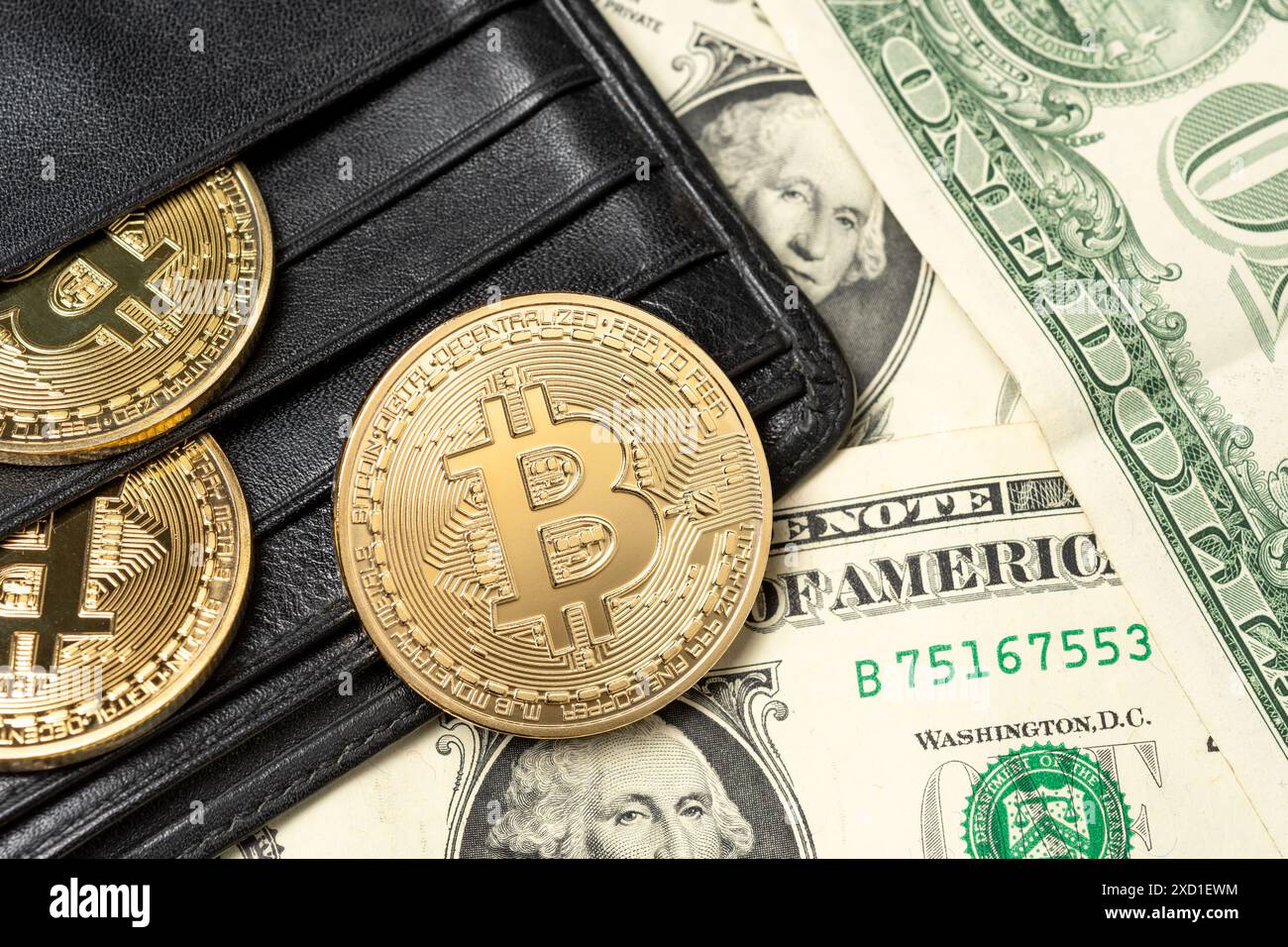 Gold coins of a cryptocurrency, US dollars and the Tesla company logo on a  white background Stock Photo - Alamy