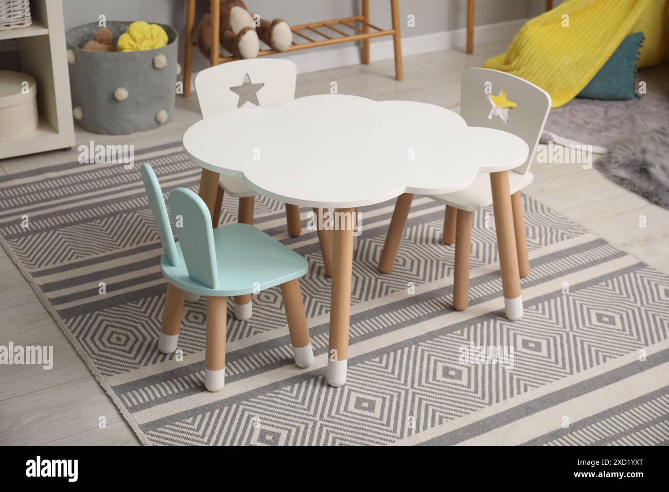 Stylish child room interior with table and chairs Stock Photo - Alamy