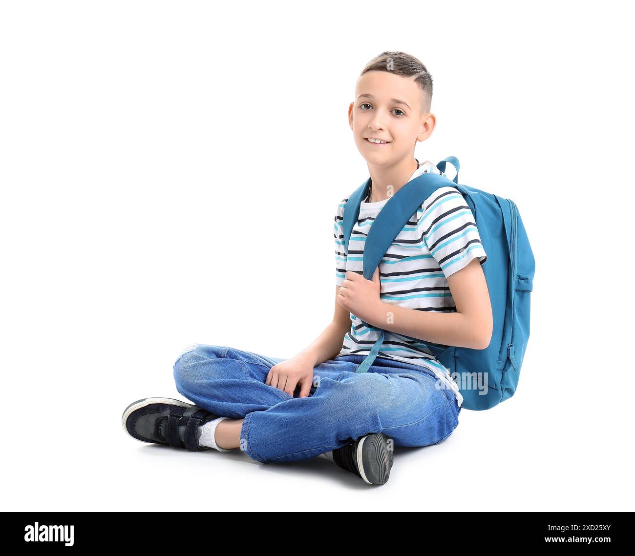 Cute schoolboy with blue backpack on white background Stock Photo - Alamy