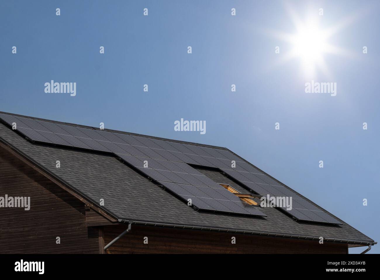 Solar Panels on House Roof in Sunlight Stock Photo