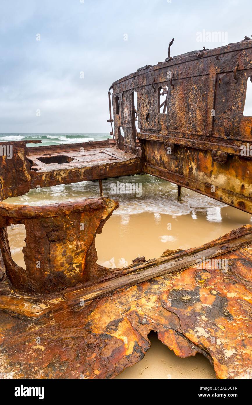 Close-Up of Rusty Ship Wreck on Beach of Fraser Island, Queensland, Australia. Stock Photo