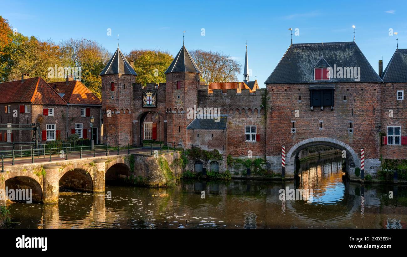 The iconic Koppelpoort medieval gate, along with the traditional red ...