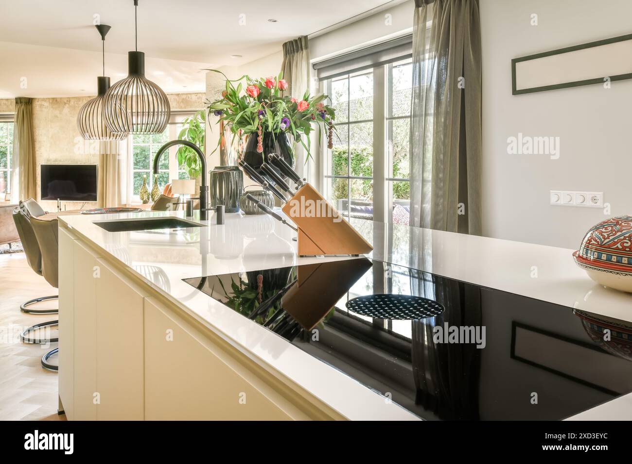 A chic and contemporary kitchen interior featuring a sleek white ...