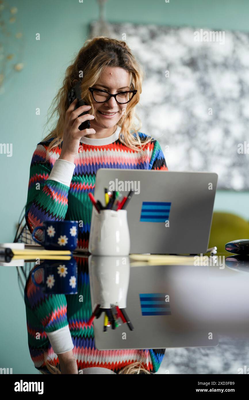 Casual young professional multitasks hi-res stock photography and ...