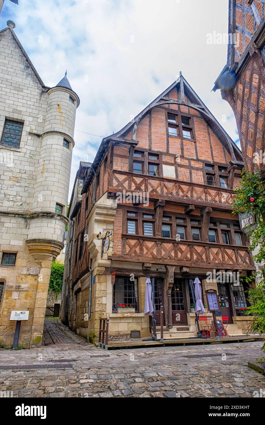 Old timber framed building architecture in narrow cobbled street in the ...