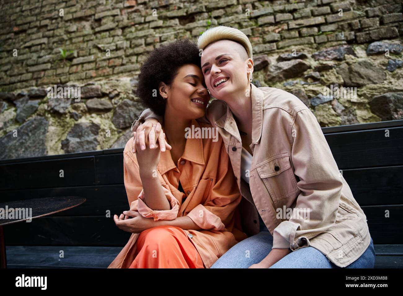 Two women sit closely on hi-res stock photography and images - Alamy