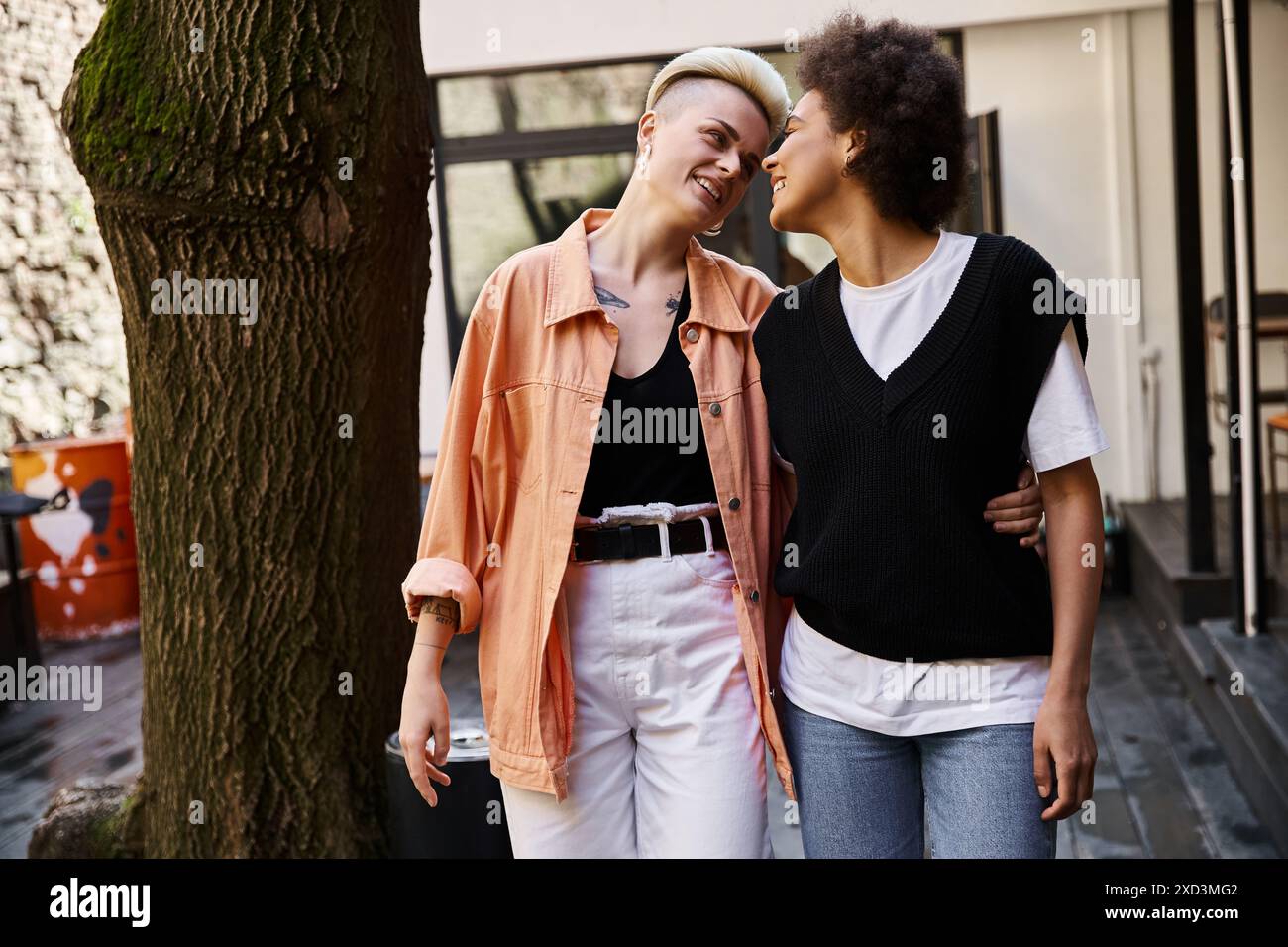 Two young women standing near hi-res stock photography and images - Alamy