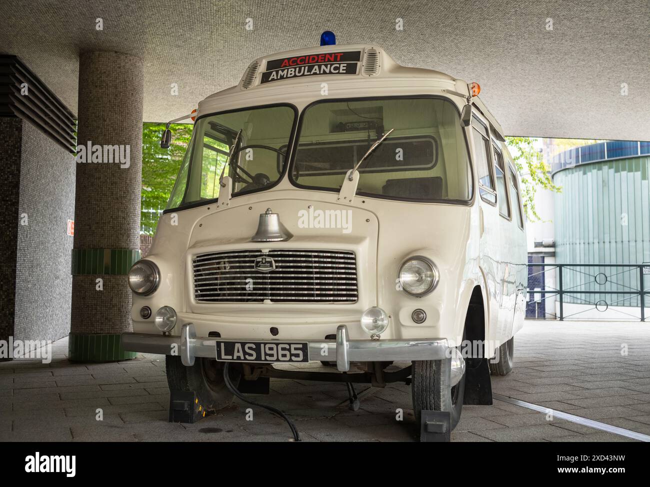 A vintage 1965 Morris LD ambulance on display outside the headquarters of the London Ambulance Service in Waterloo Road, London, UK Stock Photo