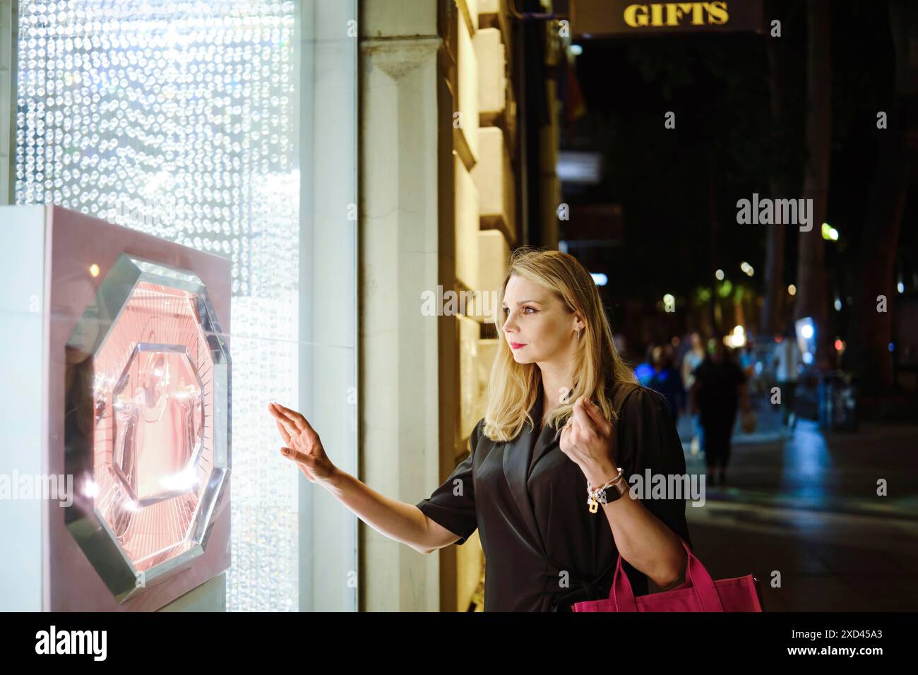 Woman walks through exhibition hi-res stock photography and images - Alamy
