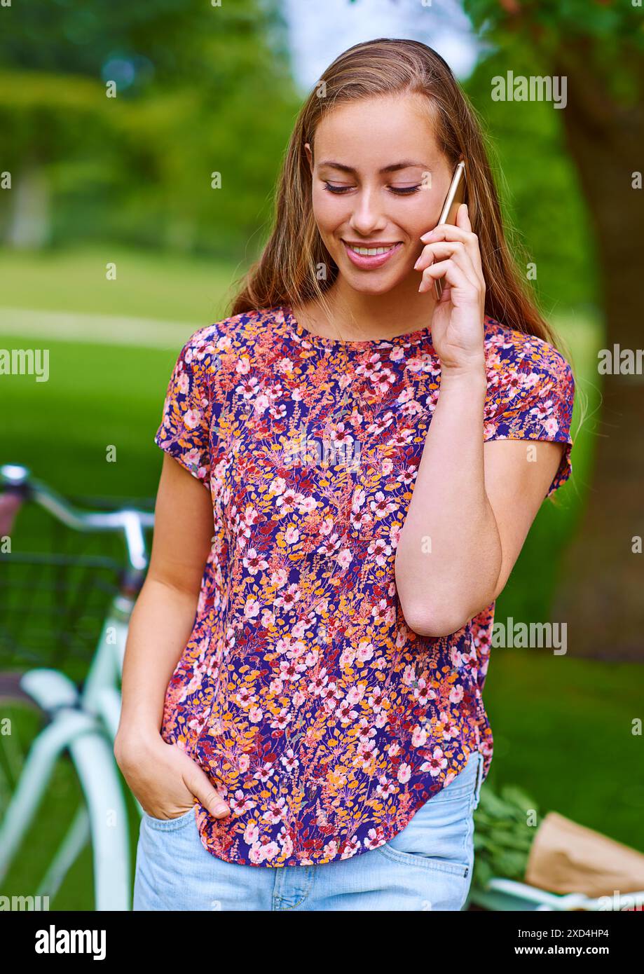 Woman, phone call and bicycle in outdoor on holiday, talking and travel ...