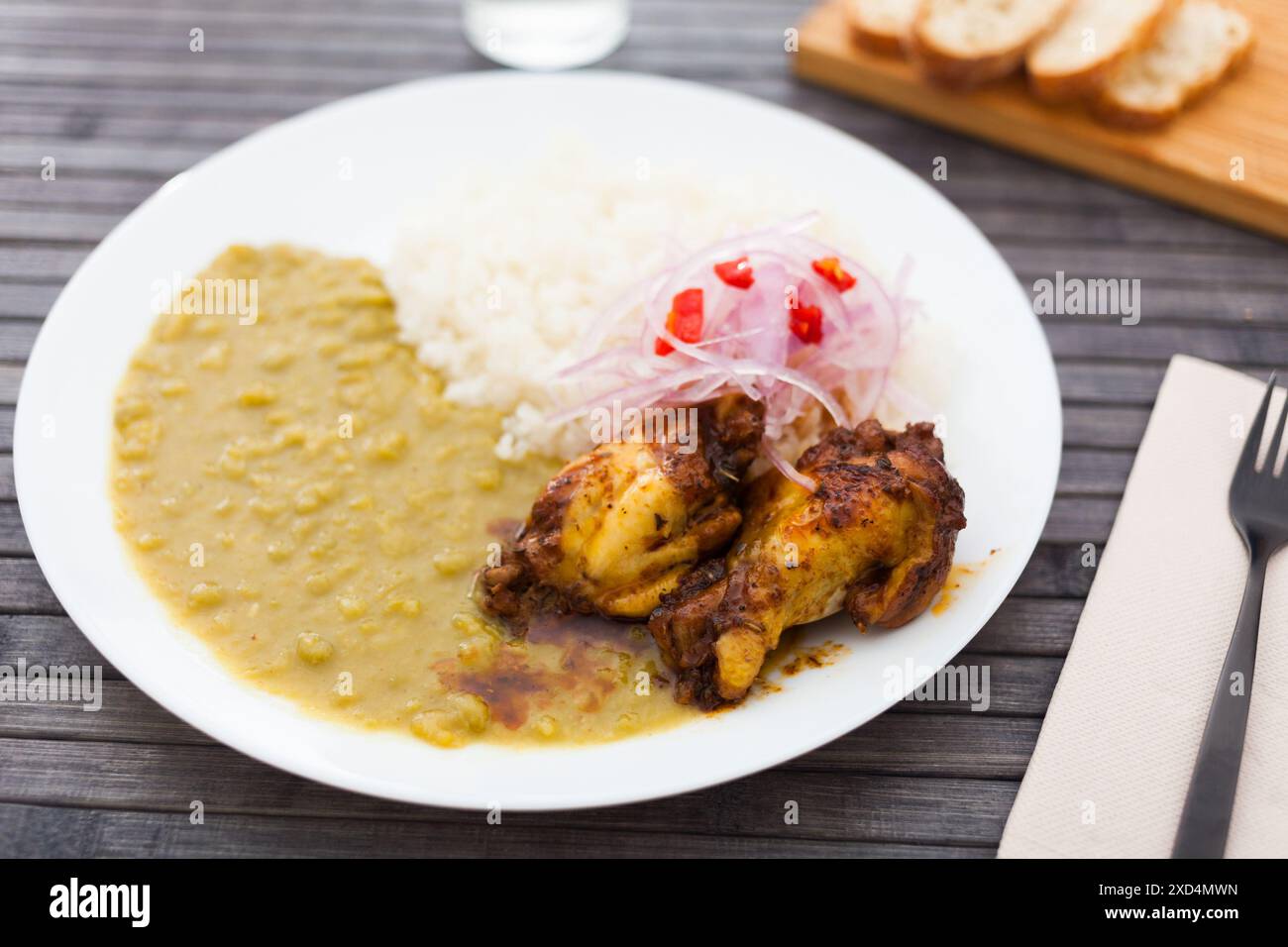 Pureed Ric Traditional Peruvian dish. chicken wings with pea puree, rice and ...