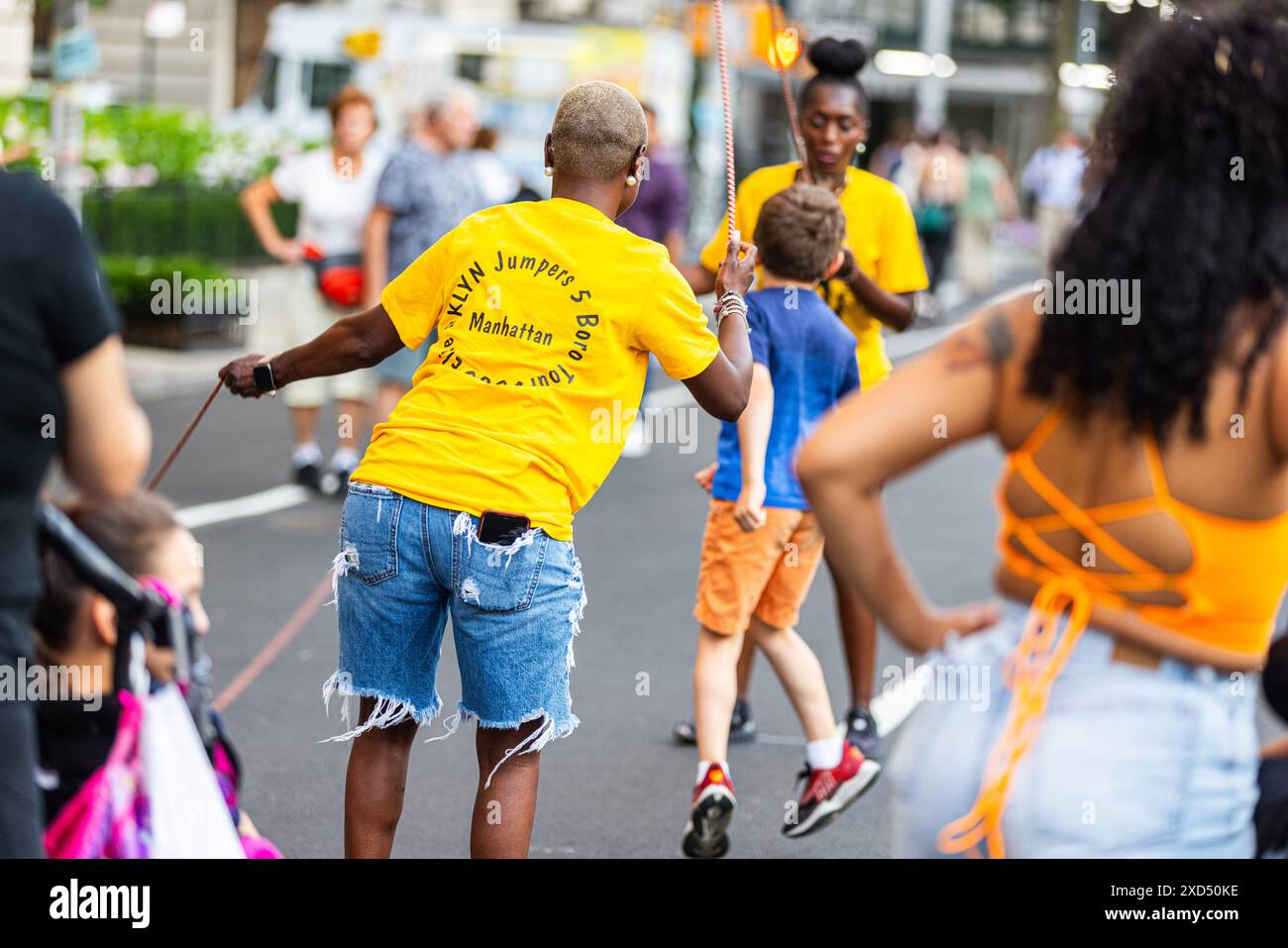 New York, USA. 18th June, 2024. Members of the Elite Bklyn Jumpers and a crowd member perform outside of the Metropolitan Museum of Art during the Museum Mile Festival in New York, NY on June 18, 2024. In its 46th year, the festival was held on Fifth Avenue between 82nd and 110th streets. The street was closed off and eight partnering museums along the 'Museum Mile' stretch of road offered free entry to the public between 6 p.m. to 9 p.m.(Photo by Hailstorm Visuals/Sipa USA) Credit: Sipa USA/Alamy Live News Stock Photo