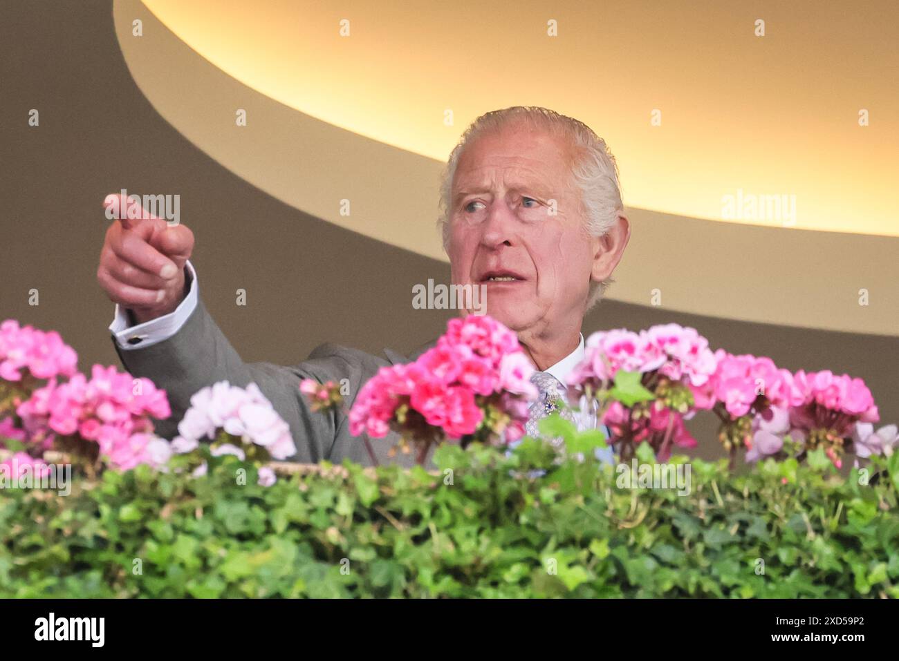 Ascot, Berkshire, UK. 20th June, 2024. The king chats on the balcony. King Charles III, Queen Camilla, the Duke and Duchess of Edinburgh and others on the balcony of the Royal Enclosure. Royal Ascot on Day 3, Ladies Day, of the horse racing event. Credit: Imageplotter/Alamy Live News Stock Photo