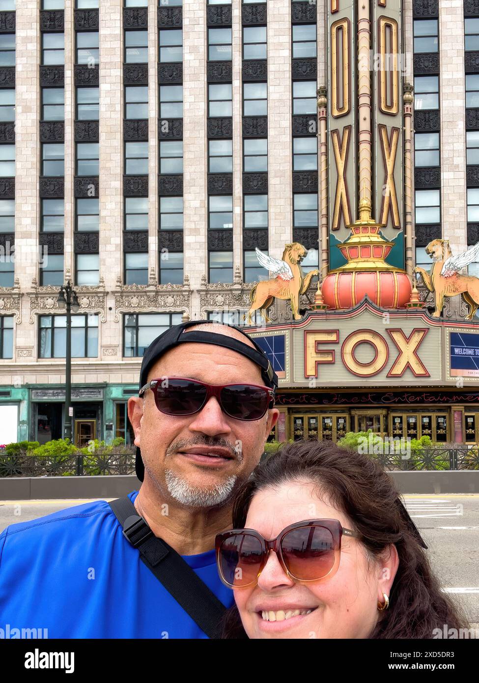 Tourist couple selfie portrait by Fox Theater, Detroit, Michigan, USA