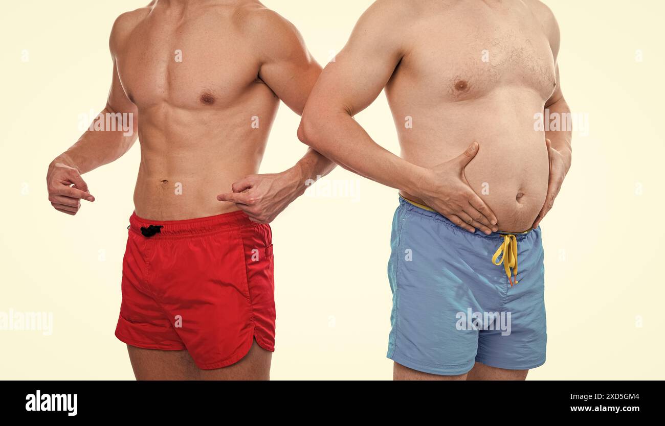 cropped view of men showing belly abs comparison. photo of men with belly abs comparison Stock Photo