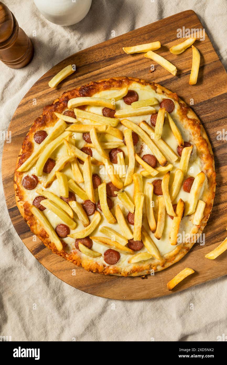 Homemade Italian Pizza Americano with French Fries and Hot Dogs Stock ...