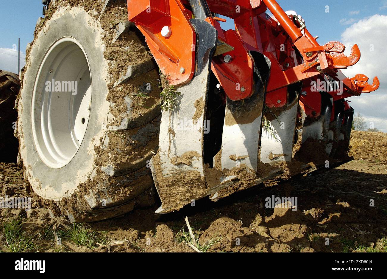 Tractor with plow at field Stock Photo - Alamy