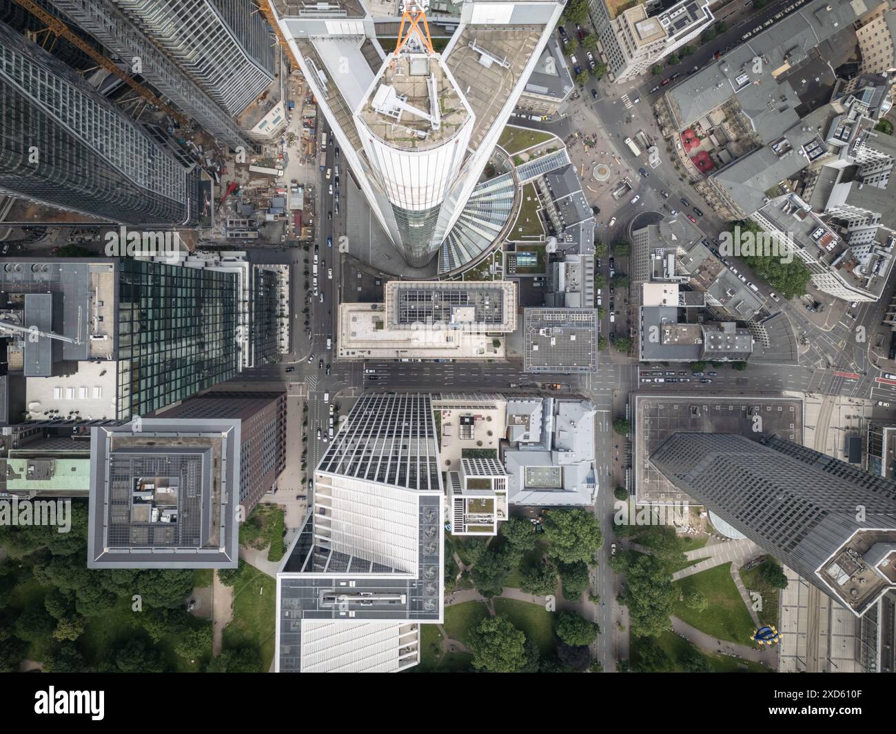 An aerial view of modern skyscrapers and streets in a bustling city ...