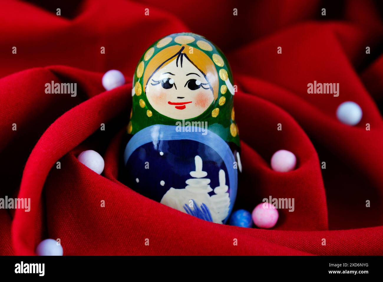 Matryoshka Rag Spheres and Matryoshka on red fabric background Stock Photo - Alamy