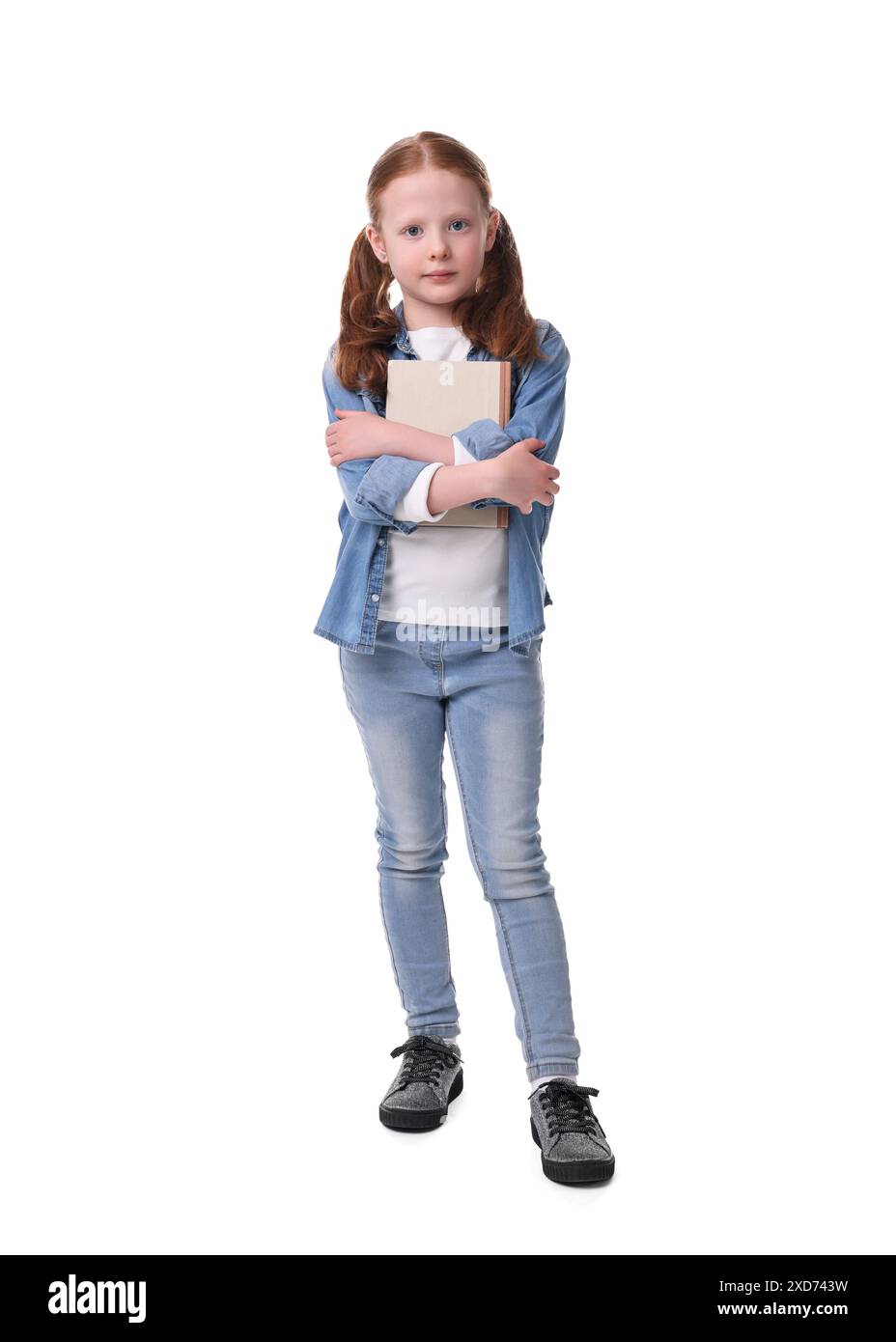 Cute little girl with book on white background Stock Photo - Alamy