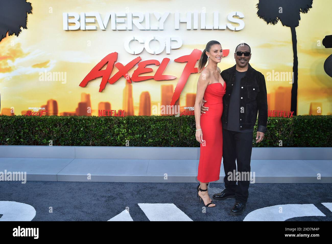 Paige Butcher, left, and Eddie Murphy arrive at the premiere of ...